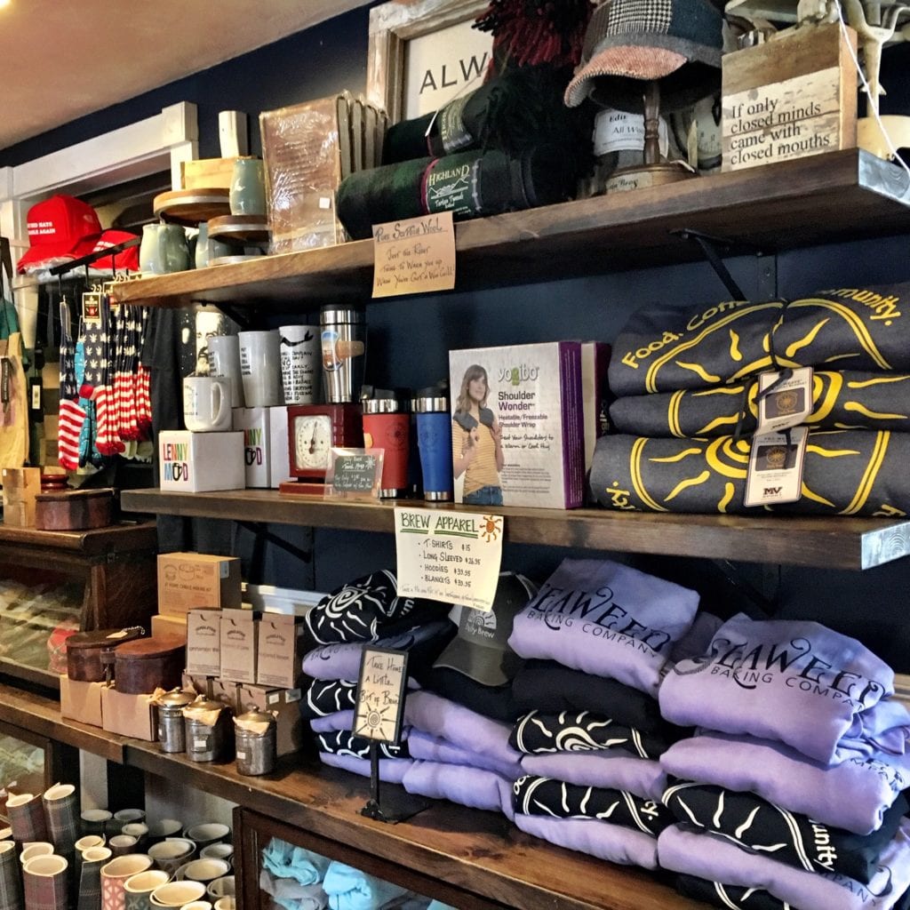 Large display of sweatshirts and other Daily Brew items for sale at a popular coffee shop near North Falmouth Massachusetts on Cape Cod.